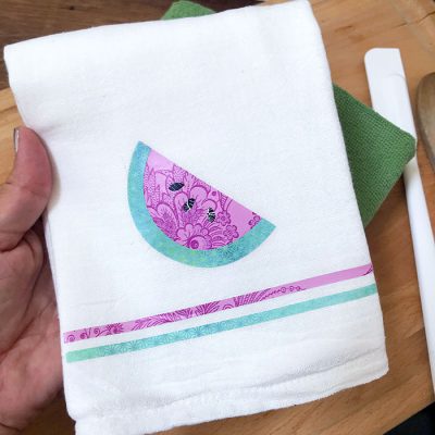 Use iron-on vinyl to decorate a hand towel
