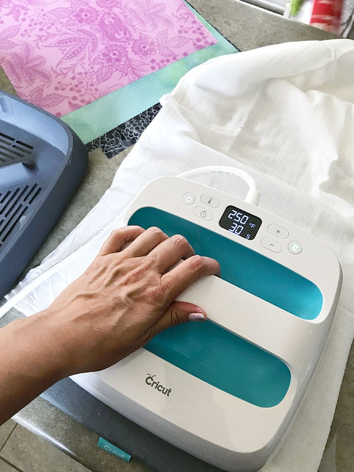 Iron the vinyl to the fabric with your iron or an EasyPress from Cricut