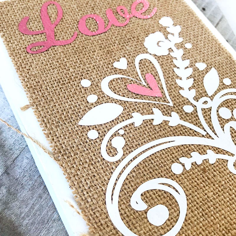 Use iron-on vinyl to create pretty designs on your burlap decor