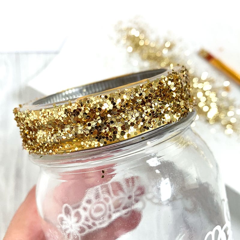 Add gold paint and glitter to the jar lid