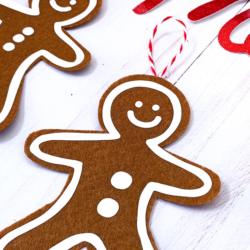 Use iron-on vinyl to make your own gingerbread man ornament - designed by Jen Goode to make with your Cricut