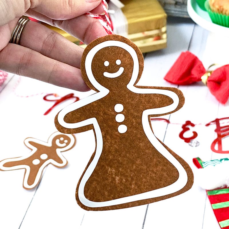 Make this cute gingerbread women ornament with felt and iron-on vinyl and your Cricut machine. Designed by Jen Goode