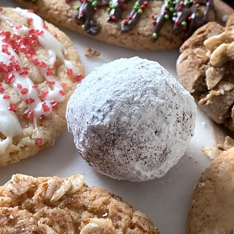 Roll a sugar cookie ball in powdered sugar