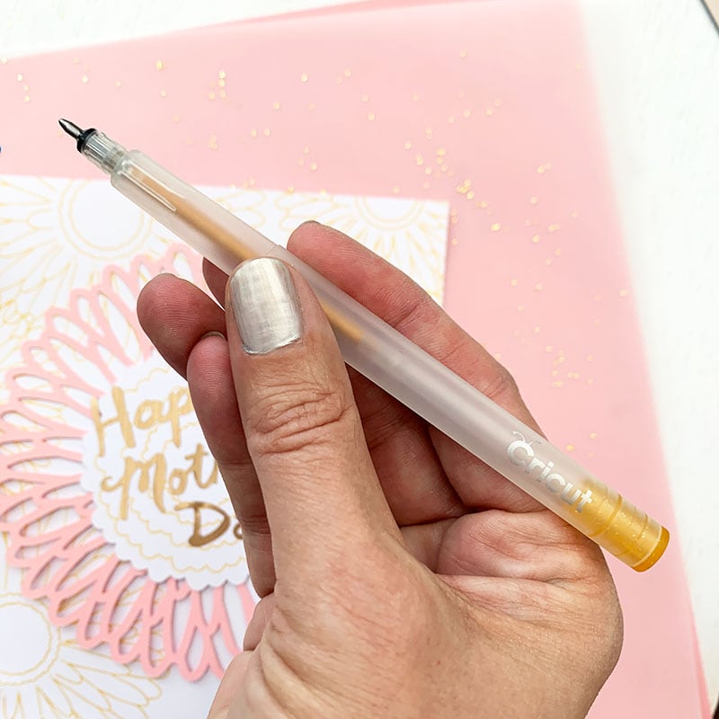 Use a Cricut glitter gel pen to add design art designs