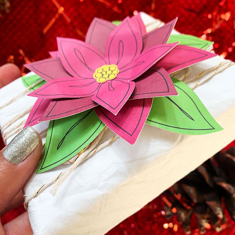 Layer flower pieces to create a flower gift topper