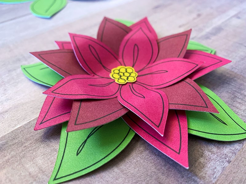 Make a pretty paper flower gift topper for your Christmas gifts