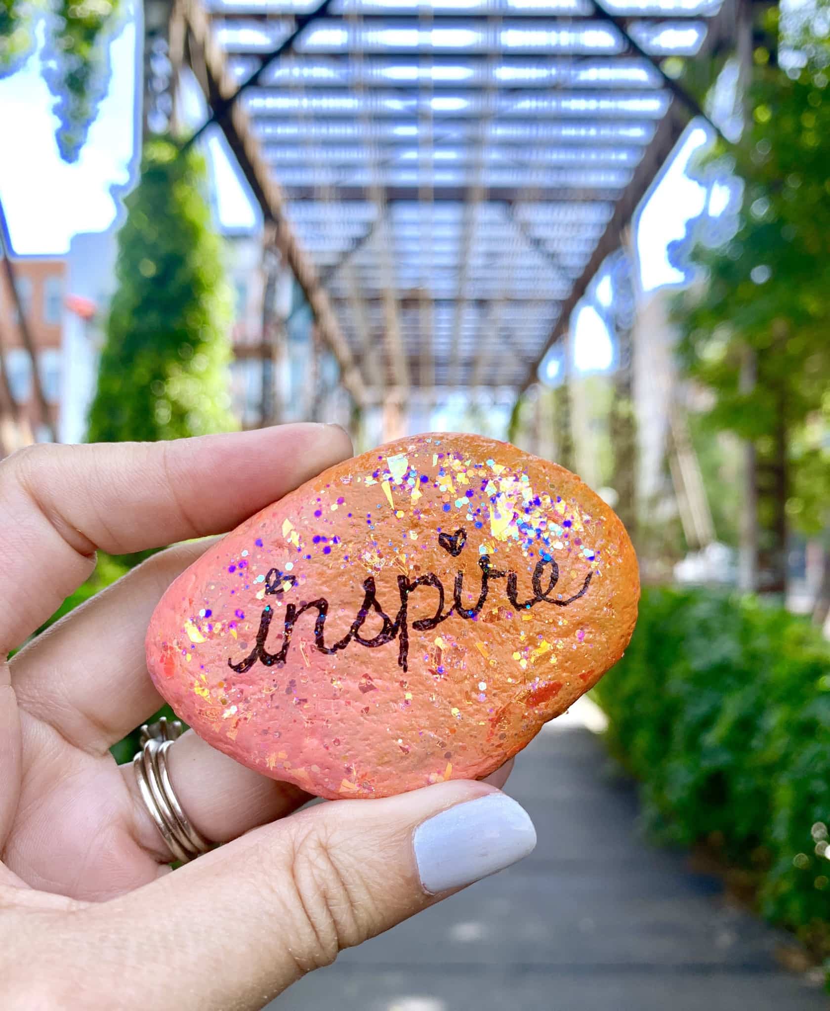  Inspire - glitter word art painted rock by Jen Goode