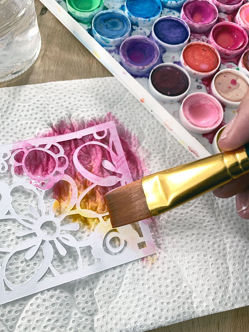 Use watercolor paints to create a color blend