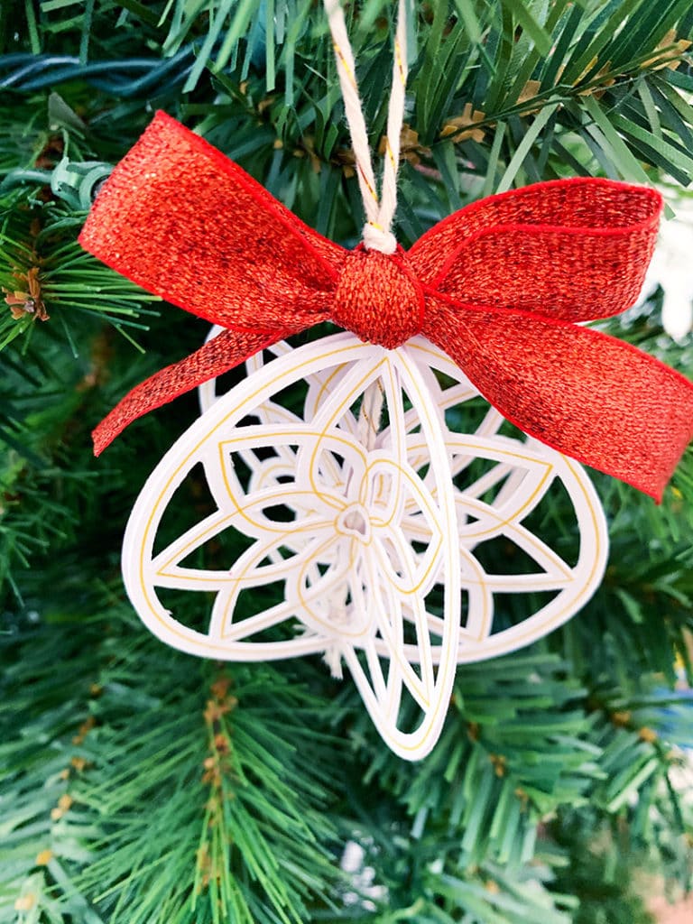 Finish your paper ornament with a pretty little bow.