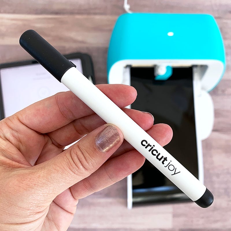 Cricut Joy comes with a black pen for drawing and writing