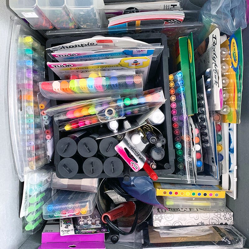 Store drawing supplies with other supplies in a cube bin