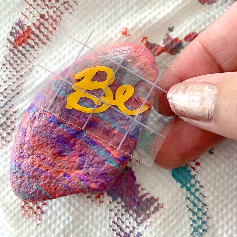 Use permanent vinyl cut with your Cricut to decorate painted rocks
