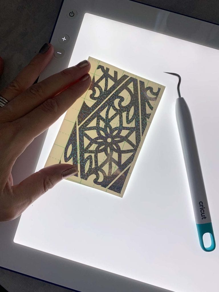 Use a Brightpad to easily weed intricate designs