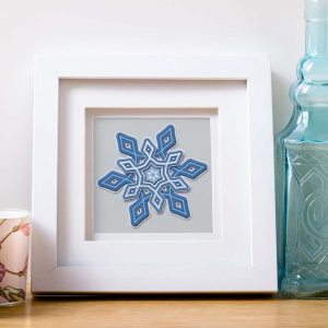 Snowflake art made with Cricut and SVG cut file designed by Jen Goode