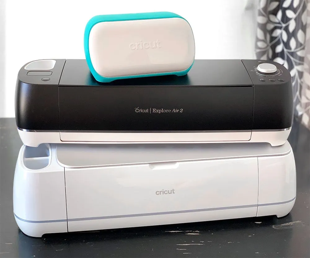 A trio of Cricut Machines - Cricut Joy, Cricut Explore Air 2 and Cricut Maker 3