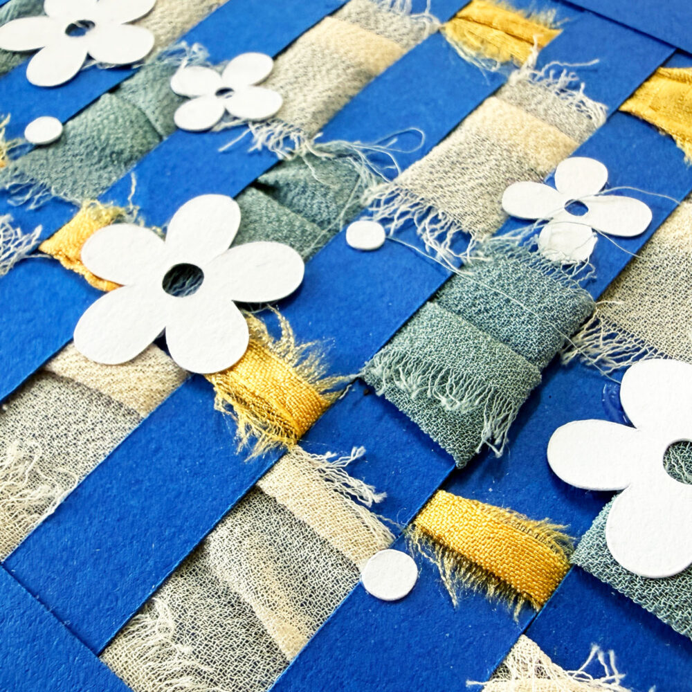 Close up of handmade card with weaving accents by Jen Goode